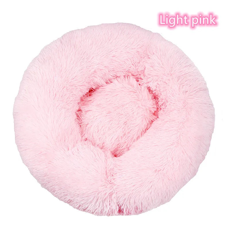 Pink calming donut cat bed with plush cushioned center