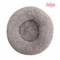 Grey round plush calming cat bed with raised rim