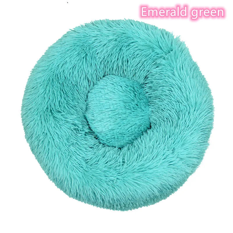 Turquoise calming donut cat bed with soft plush surface