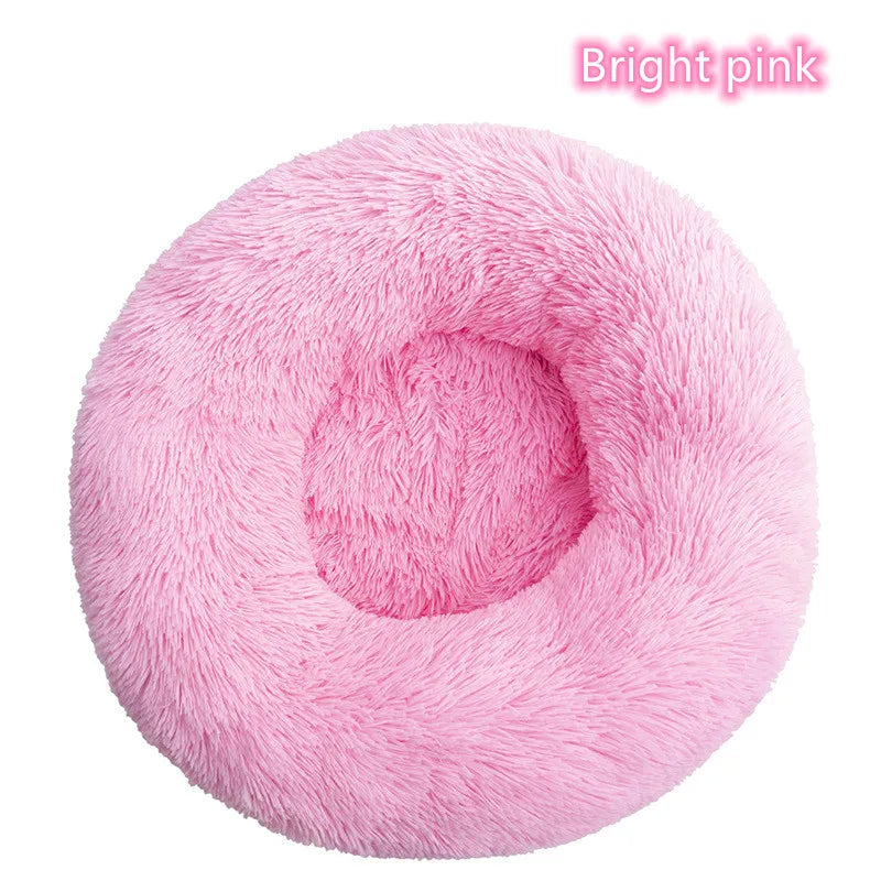 Light pink plush donut cat bed with cozy round design
