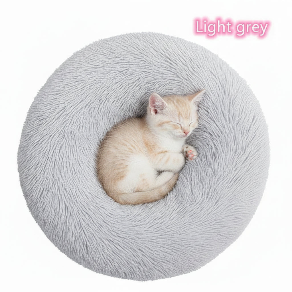 Grey calming donut cat bed with cat curled up inside
