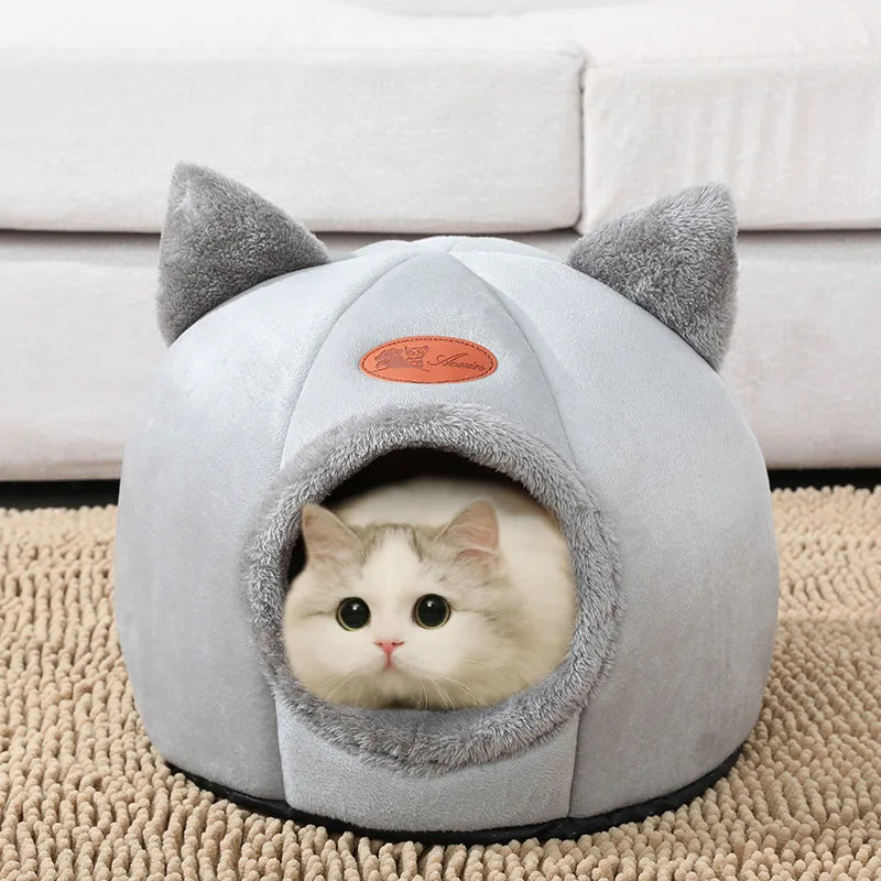 Grey enclosed cat house with cat-ear design and cozy interior